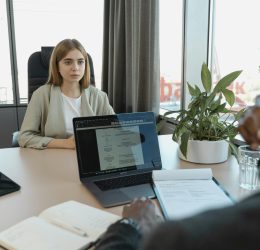 Woman in an interview wondering what not to say during a job interview